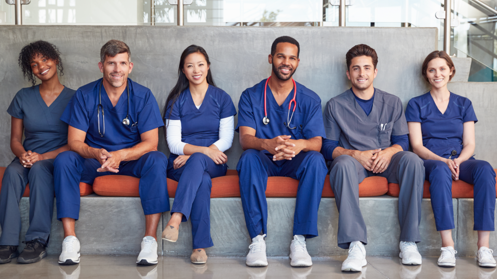 Smiling healthcare professionals representing a collaborative medical staffing team